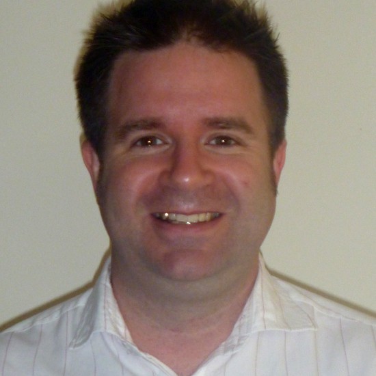 Headshot of Ben smiling at the start of Movember 2011 before growing a moustache