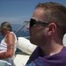 Headshot of SEO expert Gordon Campbell wearing sunglasses outdoors on a boat
