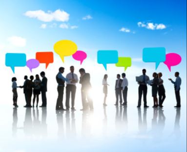 Silhouettes of business people in groups with colourful speech bubbles above them, representing online reviews and conversation
