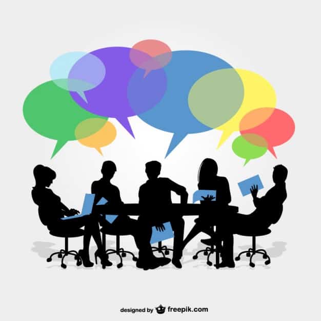 Silhouettes of people sitting around a meeting table with colourful speech bubbles above them