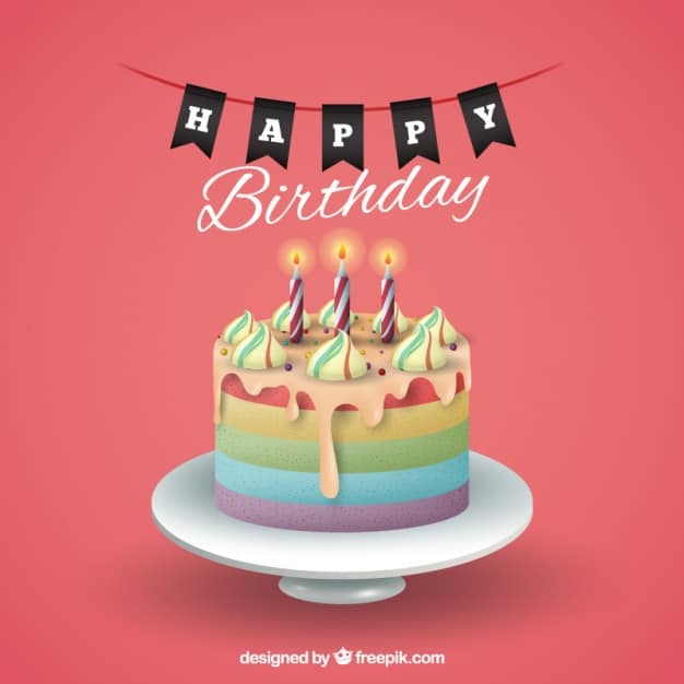 Birthday cake with lit candles and Happy Birthday bunting on a pink background