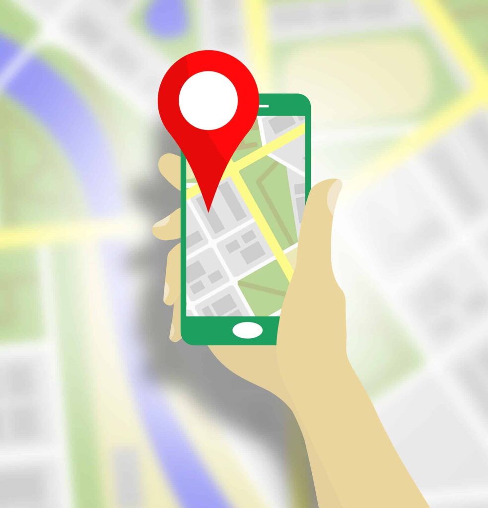 Illustrated hand holding a smartphone with a map pin on a street map, representing local SEO campaigns